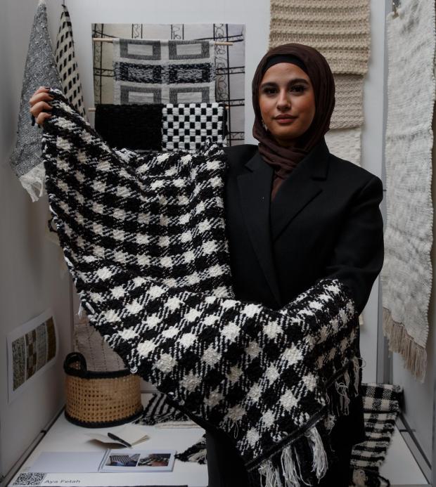 Glasgow Times: Exhibition of diplomas from the Glasgow School of Art at the Stow building.  Pictured is Textiles graduate student Aya Fetah with a prayer rug...Photograph by Colin Mearns.31 May 2022.For the Glasgow Times see story by Ann Fotheringham.