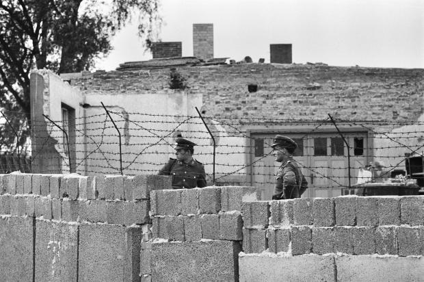 Glasgow Times: Scenes in Berlin shortly after the erection of the Berlin Wall, dividing the Soviet occupied Eastern sector of the city from the Allied occupied Western sectors. View over the wall showing border guards on patrol. October 1961. (Photo by Ron