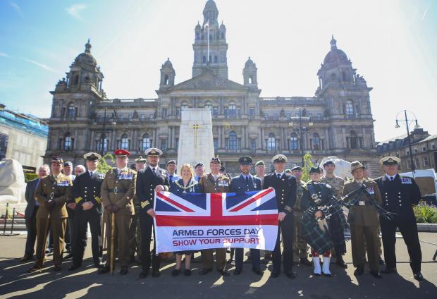 Glasgow Times: Representative of the navy, army, RAF and merchant navy along with Lord Provost Jacquline Maclaren watched as the flag for Armed Forces Day was raised at Glasgow City Chambers monday at the start of the week.