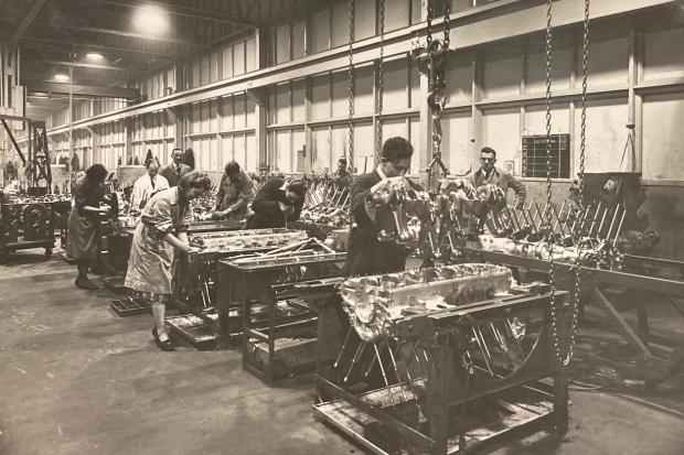 •	Rolls-Royce, Hillington: the lowering of the Merlin crankshaft unit into position, c1940 Pic: Glasgow City Archives