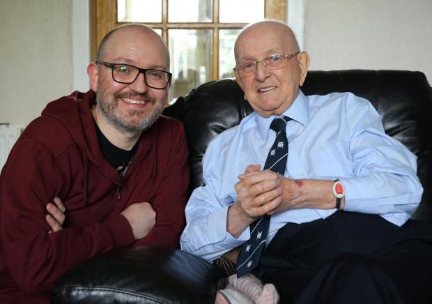 Glasgow Times: Bobby and his son Russell at home in Possilpark.Pic: Colin Mearns