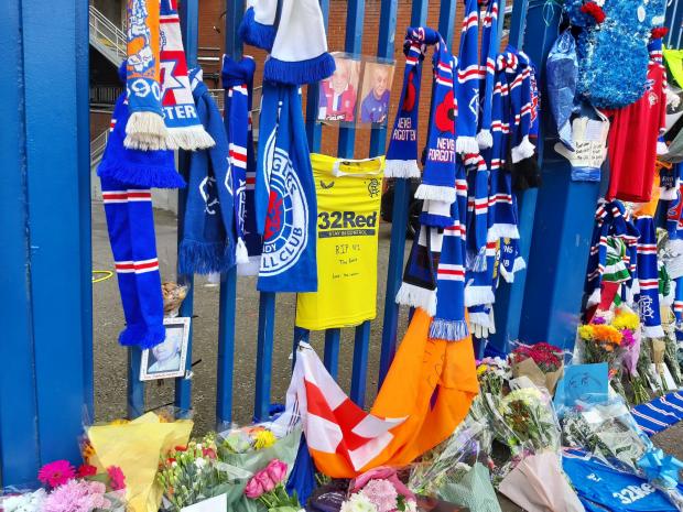 Glasgow Times: Scarves and flowers at the Ibrox gate