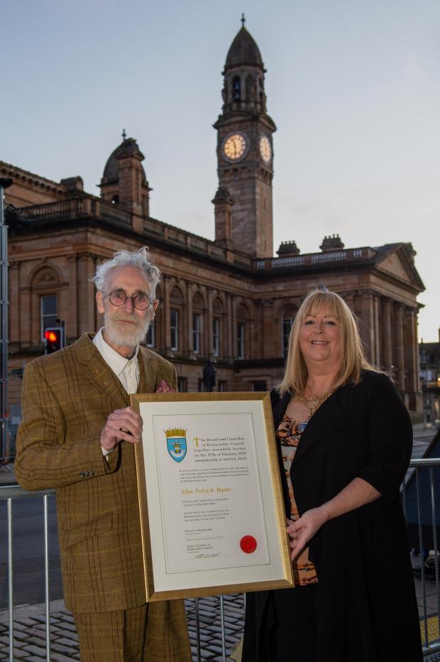 Glasgow Times: Pictured: Provost Lorraine Cameron presenting John Byrne with his Freedom of Renfrewshire earlier this year, with Paisley Town Hall behind them