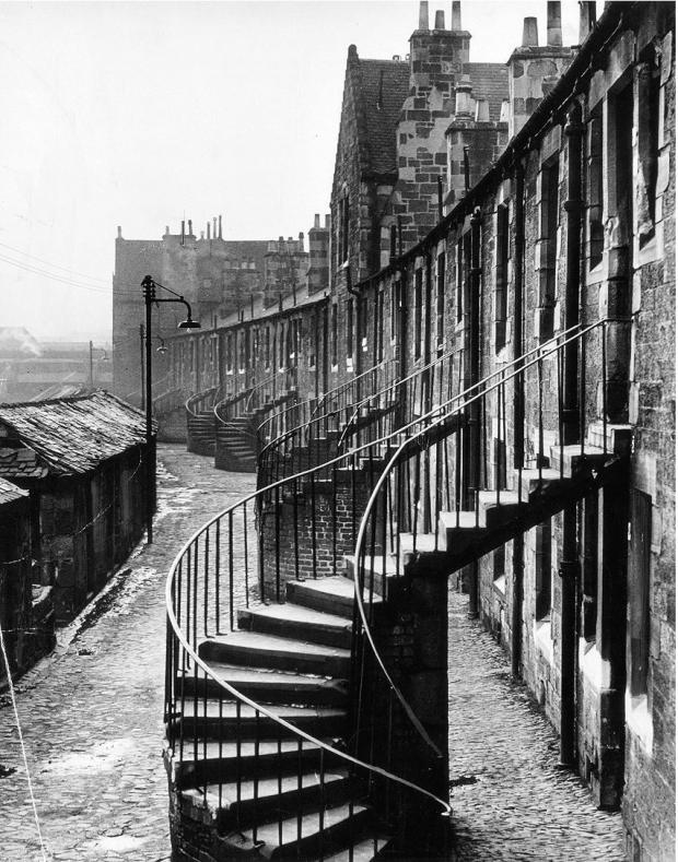Glasgow Times: A row of outside staircases near Cowlairs, Springburn, in January 1958 Pic: Newsquest