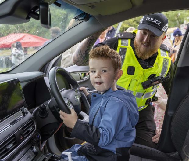 Glasgow Times: Marco MacKay 3, from Gorbals having a seat in the police car