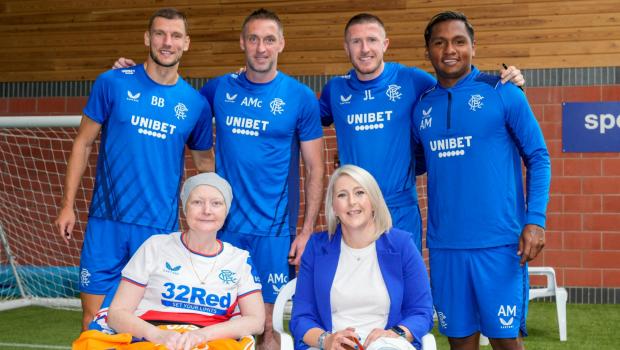 Glasgow Times: Evelyn Wilson with Rangers players Borna Barisic, Allan McGregor, John Lundstram and Alfredo Morelos