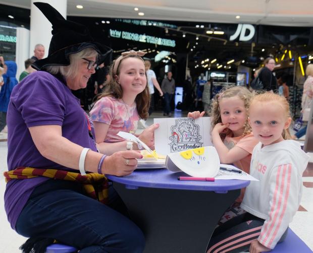 Glasgow Times: Pictured: Islay and Nieve MacDermid, from Barrhead and Jessica Jack, also from Barrhead helped by a volunteer from the Glasgow Children’s Hospital charity.
