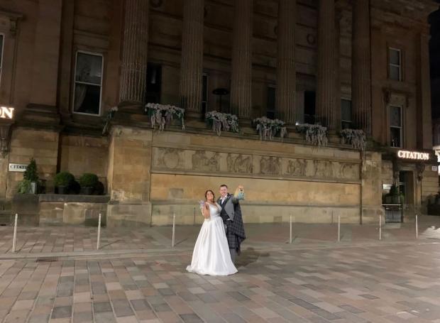 Glasgow Times: Callum and Emma posed outside their wedding venue