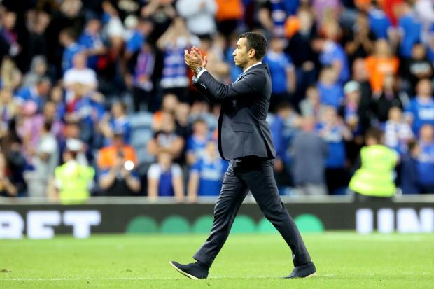 Rangers manager Giovanni van Bronckhorst applauds the fans after the UEFA Champions League, third qualifying round, second leg match at Ibrox