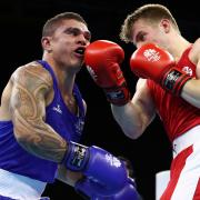 GOLD COAST, AUSTRALIA - APRIL 09:  Clay Waterman of Australia and Sean Lazzerini  of Scotland compete during the MenÃ•s Light Heavy Preliminary round during Boxing on day five of the Gold Coast 2018 Commonwealth Games at Oxenford Studios on April 9,