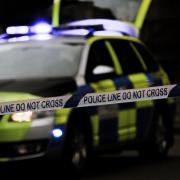 Boy, 14, arrested after 'assault' as police tape off road