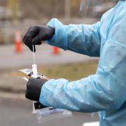 The Virginia National Guard conducts free COVID-19 testing in the Cumberland Square Park parking lot in Bristol, Va., on Friday, Dec. 18, 2020. The Mount Rogers Health District and the Virginia National Guard have been testing throughout Southwest