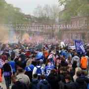Rangers fans celebrate the club winning the Scottish Premiership in the city centre