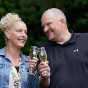 Paul and Louise Drake celebrate their win at Deer Park Golf and Country Club. (PA)