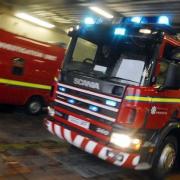 Glasgow road closed after bus deliberately set on fire