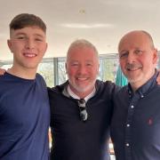 Rangers legend Ally McCoist poses with staff during visit to Glasgow restaurant