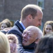 William Burns, 66, moved millions of Britons on Wednesday, after being pictured sharing a tearful embrace with the Duke of Cambridge during his visit to Glasgow. (Pictures: Jeff Holmes/PA)