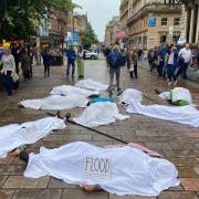Climate activists stage city centre 'die-in' protest following record temperatures