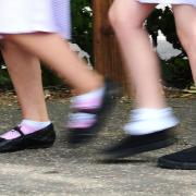 Pupils walking to school in uniform. Credit: PA