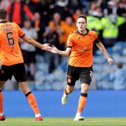 Dundee United's Liam Smith celebrates scoring their side's first goal of the game with team-mate Ross Graham during the cinch Premiership match at Ibrox