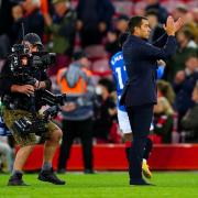 Rangers manager Giovanni van Bronckhorst applauds the fans at the end of the UEFA Champions League, Group A match at Anfield