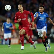 Virgil van Dijk of Liverpool is challenged by Malik Tillman of Rangers during the UEFA Champions League group A match between Liverpool FC and Rangers FC at Anfield