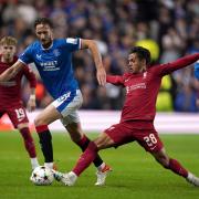 Rangers Ben Davies and Liverpool's Fabio Carvalho (right) during the UEFA Champions League Group A match