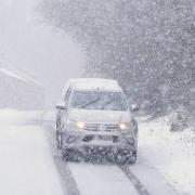 Amber weather warning in force as snow brings travel disruption