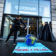 Climate activists protest outside city centre bank