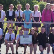 Pupils from St Mary's and Lanark Primary Schools which helped Nil by Mouth reach the milestone