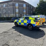 Glasgow crime: Police lock down road after man injured