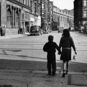 Two children take their ginger bottles back to the shop, Glasgow, 1963