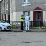 Man dies after being found injured at Glasgow flat as forensics comb scene