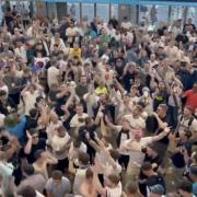 Tottenham fans celebrate on the stadium concourse
