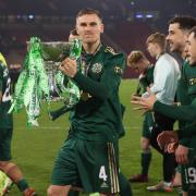 Celtic players celebrate with the Premier Sports Cup trophy during the Premier Sports Cup Final between Celtic and Hibernian at Hampden Park, on December 19, 2021