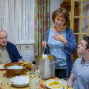 Jamie, right, as Ian in Two Doors Down, with co-stars Alex Norton and Arabella Weir as his parents Eric and Beth