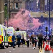 Thug threw bottles at police officers during Rangers title celebrations