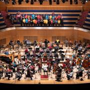 Young musicians perform on stage with Royal Scottish National Orchestra