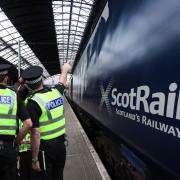 Police Scotland officers/ ScotRail train