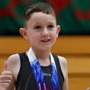 Schoolboy missing part of spine becomes talented gymnast