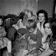 A family crowding into a Glasgow tenement