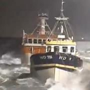 Handout screengrab from video issued by Irish Coast Guard - Dun Laoghaire of the conditions as Storm Isha passes through Dun Laoghaire harbour on Sunday evening.