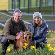 Rob and Dianne Hewgill with Oscar outside the University of Glasgow Small Animal Hospital
