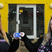 Bekki Florence (left), nursery nurse, and Carrie Lloyd (right), Manager with the £1,000 voucher