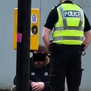 The man was spotted speaking to four police officers