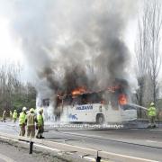 Bus bursts into flames on busy road in shocking scenes