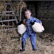 Beth Strange (7) from Mossneuk Primary brings two crocheted sheep to the National Museum of Rural Life ahead of the East Kilbride attraction’s Woolly Weekend event on May 18 and 19