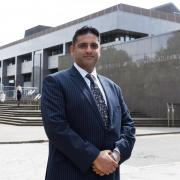 Haroun Malik, Solicitor and partner at MCO Defence solicitors. Pictured outside Glasgow Sheriff Court. Photograph by Colin Mearns.