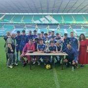 Glasgow under-18s team celebrate cup win after match at Celtic Park