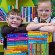 Specsavers Trongate gifted 120 books to the St Francis Primary pupils